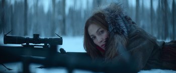Movie still from “The Mother” (2023), directed by Niki Caro – A woman in a fur coat leaning out of a car window; Close Up shot, Over the shoulder angle
