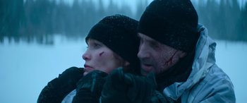 Movie still from “The Mother” (2023), directed by Niki Caro – A man and a woman with blood on their faces; Close Up shot, Low angle