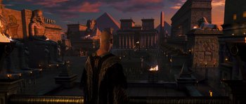 Movie still from “The Mummy” (1999), directed by Stephen Sommers – A man standing in front of an egyptian scene; Extreme Wide shot, High angle