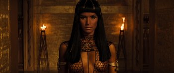 Movie still from “The Mummy” (1999), directed by Stephen Sommers – A woman in a black outfit and a black wig; Close Up shot, Low angle
