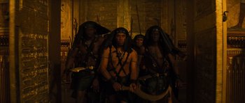 Movie still from “The Mummy” (1999), directed by Stephen Sommers – A group of men dressed in ancient egyptian clothing; Medium shot, High angle