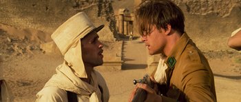 Movie still from “The Mummy” (1999), directed by Stephen Sommers – Two men are talking in the desert; Close Up shot, Over the shoulder angle