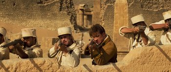 Movie still from “The Mummy” (1999), directed by Stephen Sommers – A couple of people that are taking a picture; Medium shot, Low angle