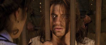 Movie still from “The Mummy” (1999), directed by Stephen Sommers – A person with long brown hair; Close Up shot, Over the shoulder angle