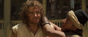 Movie still from “The Mummy” (1999), directed by Stephen Sommers – A person with long hair; Close Up shot, Over the shoulder angle