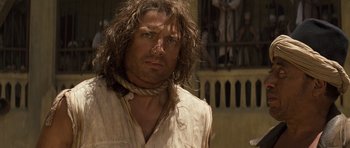 Movie still from “The Mummy” (1999), directed by Stephen Sommers – A person with long hair; Close Up shot, Over the shoulder angle