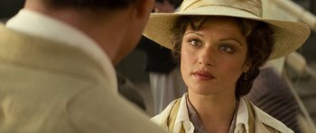 Movie still from “The Mummy” (1999), directed by Stephen Sommers – A woman wearing a straw hat looking at a man in a suit; Close Up shot, Over the shoulder angle
