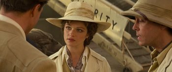 Movie still from “The Mummy” (1999), directed by Stephen Sommers – A woman wearing a straw hat and a beige jacket; Close Up shot, Over the shoulder angle