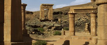Movie still from “The Mummy” (1999), directed by Stephen Sommers – An ancient stone structure in the middle of the desert; Extreme Wide shot, Low angle