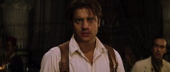 Movie still from “The Mummy” (1999), directed by Stephen Sommers – A person wearing suspenders; Close Up shot, Low angle