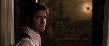 Movie still from “The Mummy” (1999), directed by Stephen Sommers – A person wearing a white shirt; Close Up shot, Over the shoulder angle