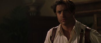 Movie still from “The Mummy” (1999), directed by Stephen Sommers – A person wearing a shirt; Close Up shot, Over the shoulder angle