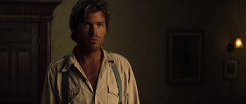 Movie still from “The Mummy” (1999), directed by Stephen Sommers – A person wearing a shirt; Close Up shot, Over the shoulder angle