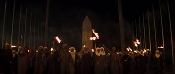 Movie still from “The Mummy” (1999), directed by Stephen Sommers – A group of people dressed in medieval clothing holding torches; Extreme Wide shot, Low angle