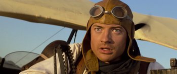 Movie still from “The Mummy” (1999), directed by Stephen Sommers – A person wearing goggles and a hat; Close Up shot, Low angle