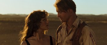 Movie still from “The Mummy” (1999), directed by Stephen Sommers – A man and a woman standing next to each other; Close Up shot, Over the shoulder angle