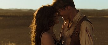 Movie still from “The Mummy” (1999), directed by Stephen Sommers – A man and a woman smiling at each other; Close Up shot, Over the shoulder angle