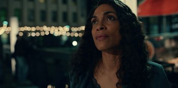 Movie still from “Dopesick” (2021), directed by Danny Strong – A person with long curly hair; Close Up shot, Over the shoulder angle