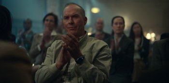 Movie still from “Dopesick” (2021), directed by Danny Strong – A man clapping his hands in front of a group of people; Close Up shot, Low angle