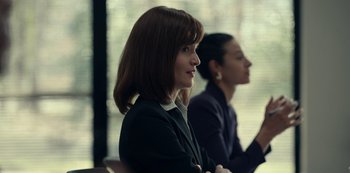 Movie still from “Dopesick” (2021), directed by Danny Strong – Two women are sitting in a conference room; Close Up shot, Over the shoulder angle