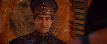 Movie still from “The Mummy” (2017), directed by Alex Kurtzman – A person wearing a costume; Close Up shot, Over the shoulder angle