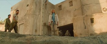 Movie still from “The Mummy” (2017), directed by Alex Kurtzman – A woman standing on top of a rock; Wide shot, Low angle