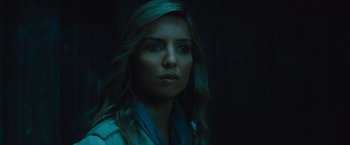 Movie still from “The Mummy” (2017), directed by Alex Kurtzman – A beautiful woman with long hair in a dimly - lit room; Close Up shot, Low angle