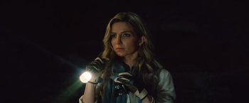 Movie still from “The Mummy” (2017), directed by Alex Kurtzman – A woman holding a flashlight while standing in the dark; Close Up shot, Low angle