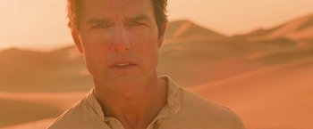 Movie still from “The Mummy” (2017), directed by Alex Kurtzman – A person in a desert setting; Close Up shot, Low angle