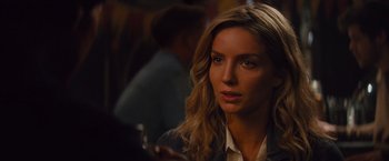 Movie still from “The Mummy” (2017), directed by Alex Kurtzman – A beautiful woman holding a cell phone in her hand; Close Up shot, Over the shoulder angle