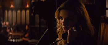 Movie still from “The Mummy” (2017), directed by Alex Kurtzman – A woman talking on a phone in the dark; Close Up shot, High angle