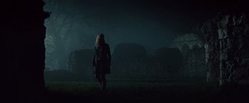 Movie still from “The Mummy” (2017), directed by Alex Kurtzman – A woman walking through a field at night; Wide shot, Low angle
