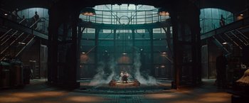 Movie still from “The Mummy” (2017), directed by Alex Kurtzman – Two people are standing in the middle of a stage with smoke coming out of it; Extreme Wide shot, Low angle