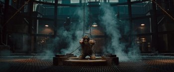 Movie still from “The Mummy” (2017), directed by Alex Kurtzman – An elephant statue chained to a platform in a building; Wide shot, Low angle