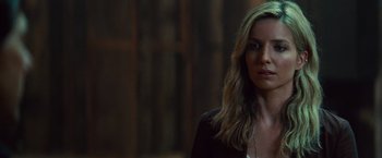 Movie still from “The Mummy” (2017), directed by Alex Kurtzman – A woman with long blonde hair wearing a black jacket; Close Up shot, Over the shoulder angle