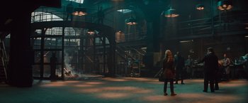 Movie still from “The Mummy” (2017), directed by Alex Kurtzman – A woman is standing in an empty warehouse; Wide shot, Low angle