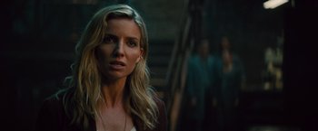 Movie still from “The Mummy” (2017), directed by Alex Kurtzman – A woman with long blonde hair standing in front of stairs; Close Up shot, Over the shoulder angle