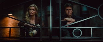 Movie still from “The Mummy” (2017), directed by Alex Kurtzman – A man and a woman sitting next to each other; Medium shot, Low angle