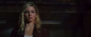 Movie still from “The Mummy” (2017), directed by Alex Kurtzman – A woman with long blonde hair wearing a brown jacket; Close Up shot, Low angle