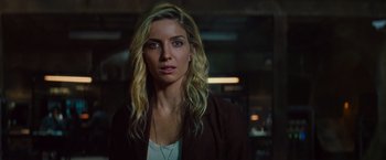 Movie still from “The Mummy” (2017), directed by Alex Kurtzman – A woman with long blonde hair wearing a brown jacket; Close Up shot, Over the shoulder angle