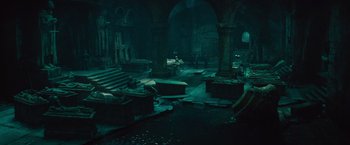 Movie still from “The Mummy” (2017), directed by Alex Kurtzman – A dark room filled with a lot of debris; Extreme Wide shot, High angle