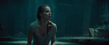 Movie still from “The Mummy” (2017), directed by Alex Kurtzman – A woman sitting in the water looking up at the sky; Close Up shot, Over the shoulder angle