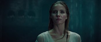 Movie still from “The Mummy” (2017), directed by Alex Kurtzman – A woman with wet hair is looking at the camera; Close Up shot, Low angle