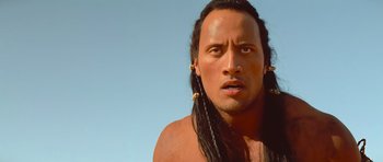 Movie still from “The Mummy Returns” (2001), directed by Stephen Sommers – A person with long black hair; Close Up shot, Low angle