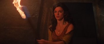 Movie still from “The Mummy Returns” (2001), directed by Stephen Sommers – A beautiful woman in a brown and yellow dress; Close Up shot, Over the shoulder angle