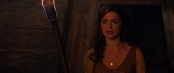 Movie still from “The Mummy Returns” (2001), directed by Stephen Sommers – A woman standing in front of a lit candle; Close Up shot, Over the shoulder angle