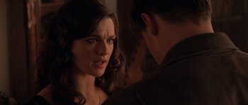 Movie still from “The Mummy Returns” (2001), directed by Stephen Sommers – A young woman looking at a young man in a dark room; Close Up shot, Over the shoulder angle