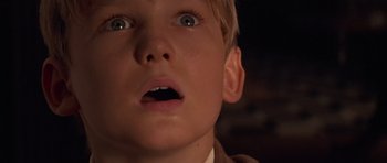 Movie still from “The Mummy Returns” (2001), directed by Stephen Sommers – A young boy's face with his mouth wide open; Close Up shot, Low angle
