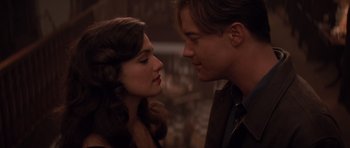 Movie still from “The Mummy Returns” (2001), directed by Stephen Sommers – A man and a woman face to face in front of a bar; Close Up shot, Low angle