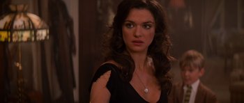 Movie still from “The Mummy Returns” (2001), directed by Stephen Sommers – A beautiful woman with long brown hair wearing a black top; Close Up shot, Over the shoulder angle